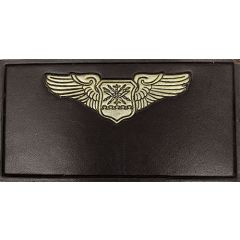 Embossed and painted, brown, silver with black outline.